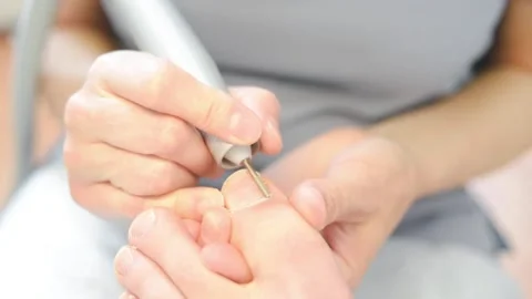 Woman master pedicures a man. Stock Footage 130614735