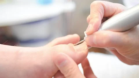 Woman master pedicures a man. Stock Footage 130614867