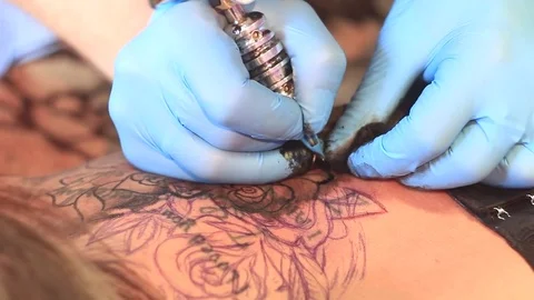 Woman master tattoo on back Stock Footage