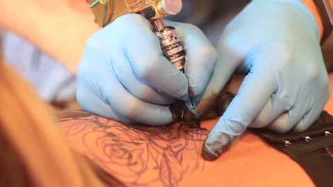 Woman master tattoo on back Stock Footage 80592152