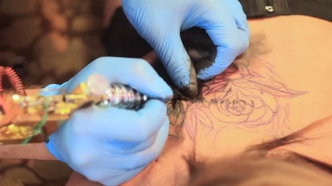 Woman master tattoo on back Stock Footage 80592356