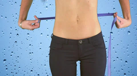 Woman measuring Stockbeeldmateriaal 31403384