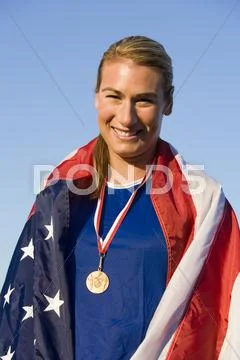 Woman With Medal Wrapped In American Flag Stock Photos