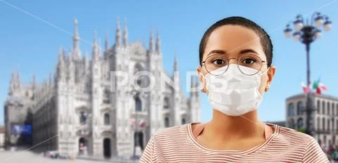 Woman in medical mask over milano cathedral, italy Stock Photos