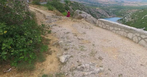 Woman meditating at beautiful Zrmanja river, Croatia Stock Footage 59553607