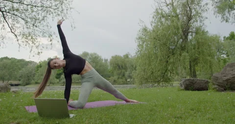 Woman meditating doing light exercise, zen yoga meditation practice in nature Stock Footage 217918891