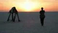 Woman meeting sunrise at the dry lake HD Footage