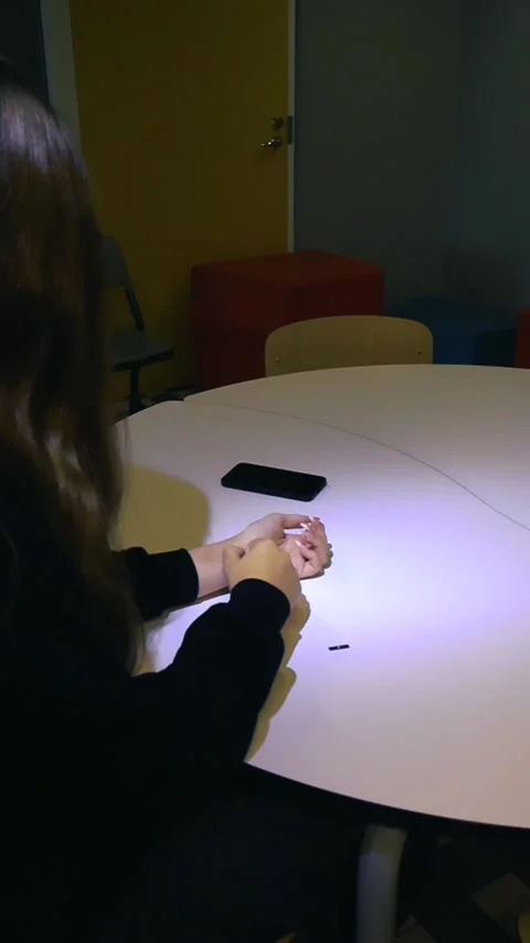 Woman meticulously applying a screen protector to her smartphone Vídeos de archivo 345550754