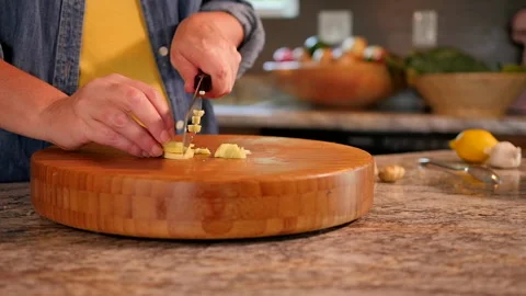 Woman mincing ginger in kitchen. Stock Footage 138333087
