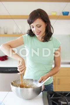 Woman Mixing Cookie Dough, Portland, Oregon, Usa
