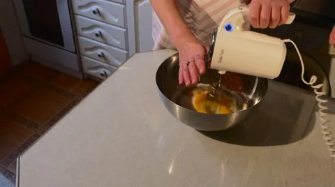 Woman is Mixing Eggs and Flour With Vintage Mixer Preparing a Dough For Cake Stock Footage 59124863