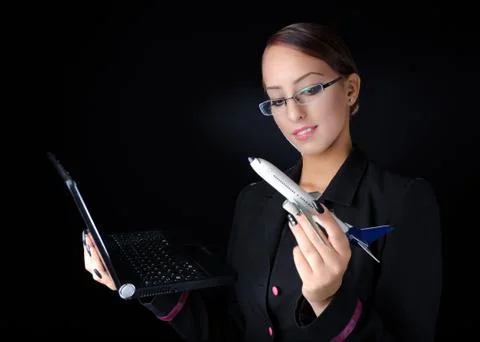 Woman With Model Airplane and Laptop Stock Photos