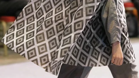 Woman model in grey square pattern dress walks down runway. Female vogue catwalk Video stock 160247586