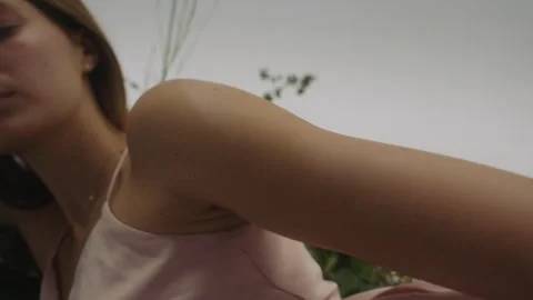 Woman model posing elegantly while looking at camera in natural setting Vídeos de archivo 319924661