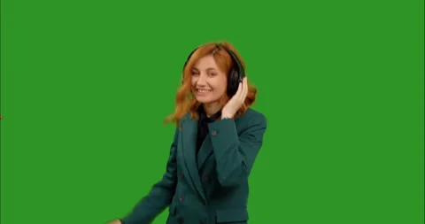 Woman moving her head while listening to music tracklist on green screen Stock Footage 295890468