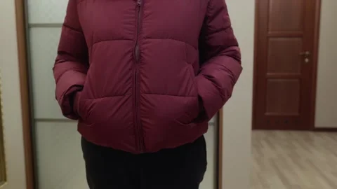 Woman moving keys between jacket pockets indoors Stock Footage 326577116