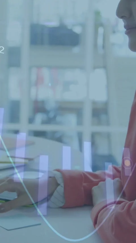 Woman moving mouse, causing animated chart while reviewing business data, Stock Footage 334317471