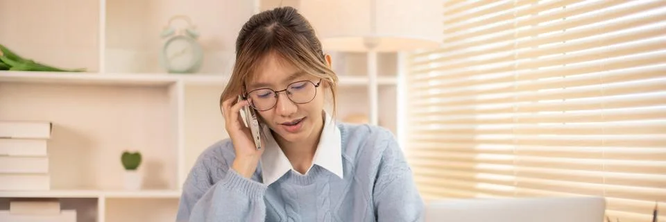 Woman Multitasking: Take note, Talking on Phone at Home Office , Home Workspa Stock Photos