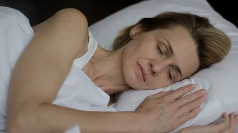 Woman napping, having optimistic, funny thought, imagines good, positive future Stock Footage 93524809