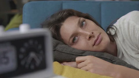 Woman napping on the sofa at home Stock Footage 150840080