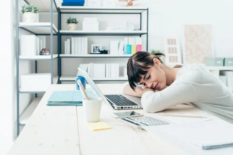 Woman napping at work Foto stock