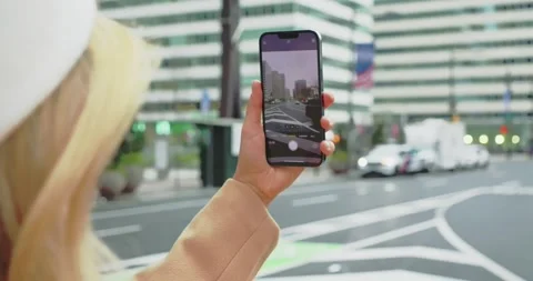 Woman Navigating City Streets Using Smartphone Stock Footage 325529472