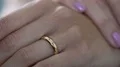 Woman nervously twisting engagement ring in hands talking with psychologist HD Footage