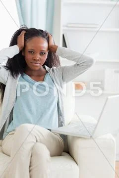 Woman not happy about her laptop Stock Photos