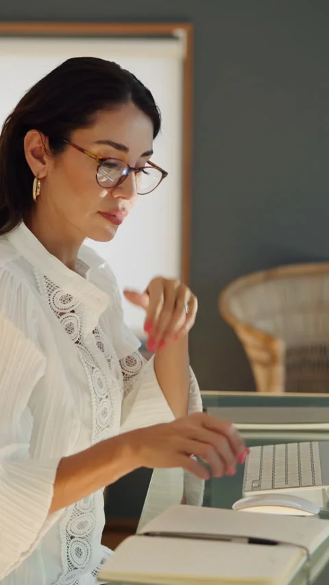 Woman, notebook and computer with remote work from home with schedule, review Stock Footage 333699014