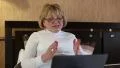 Woman with notebook. Senior woman communicates via laptop HD Footage
