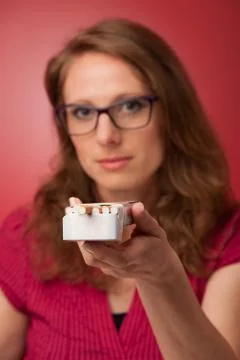 Woman offering a cigarette Stock Photos