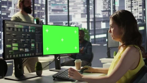 Woman in office fixing coding issues using green screen computer Video stock 318159931