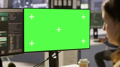 Woman in office fixing coding issues using green screen computer Video stock 318235179