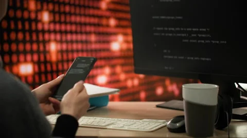 Woman in office inspecting software code on phone in her hands. Close-up shot Stock Footage 312820989