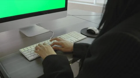 Woman In Office Using Computer Green Screen Stock Footage 98764126
