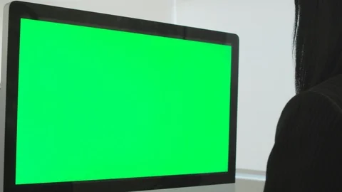 Woman In Office Using Computer Green Screen Stock Footage 98764172