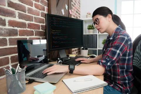 Woman office worker programming internet system Stock Photos