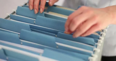 Woman office worker sorting through docu... | Stock Video | Pond5