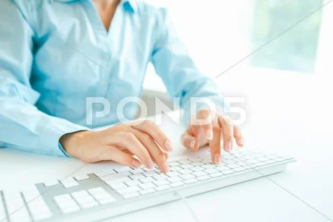 Woman office worker typing on the keyboard Stock Photos