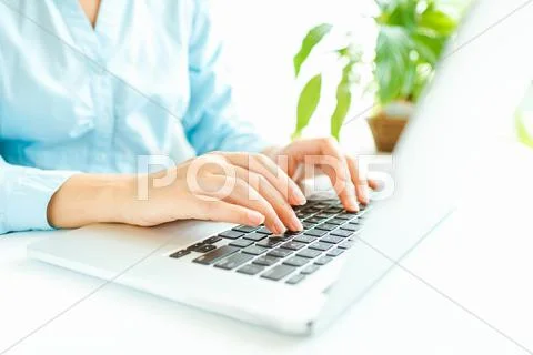 Woman office worker typing on the keyboard Stock Photos