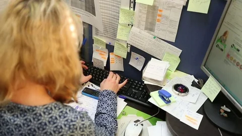 Woman in office working on computer Stock Footage 71669287