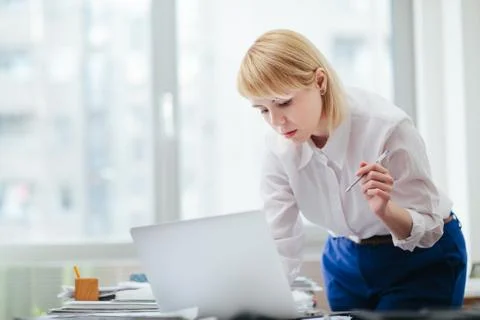 Woman in office working Stock Photos