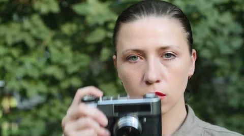 Woman with an old camera Stock Footage 27615019