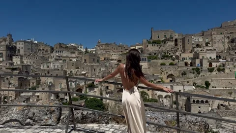 Woman With Open Arms Overlooking Sassi di Matera, Italy Stock Footage 336673757