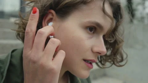 Woman open charging box with wireless earbuds Stock Footage 161060939