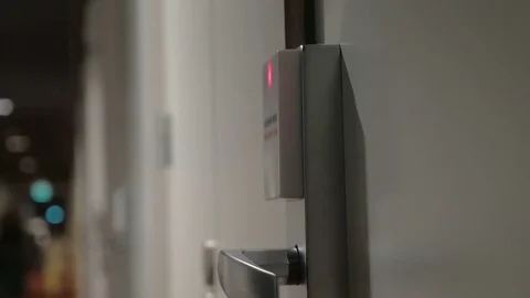 Woman opening hotel door with a cardkey Stock Footage
