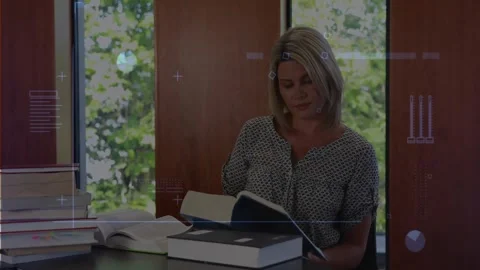 Woman opening reference book and scanning pages at desk for research, overlays Stock Footage 328246204