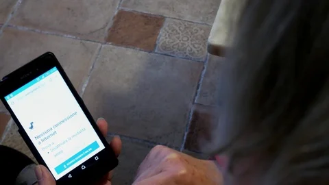 A woman opens the browser on the phone, the message "no connection" appears Stock Footage 101886745