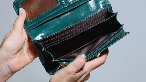 Woman opens her green empty leather wallet without money Stock Footage 88530287