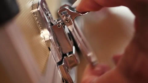 Woman opens the lock in the case Stock Footage 139384478